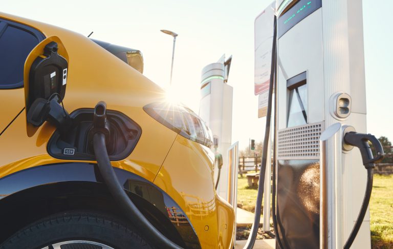 Plugged in electric car in at a EV charging station